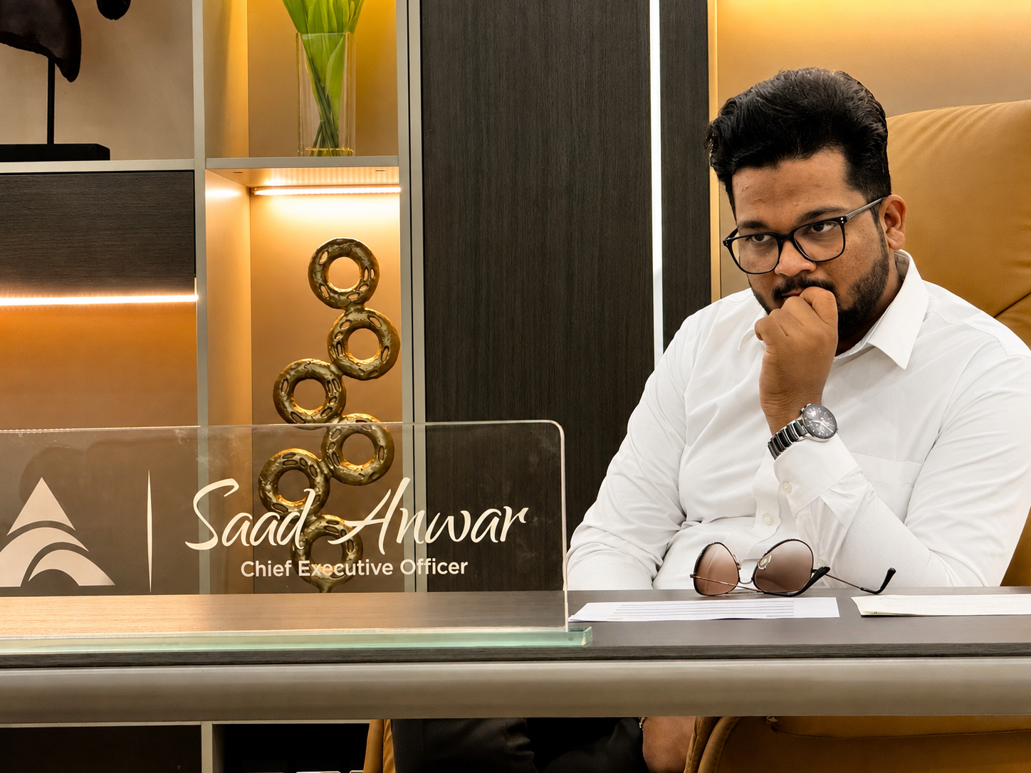 Saad Anwar at his office desk