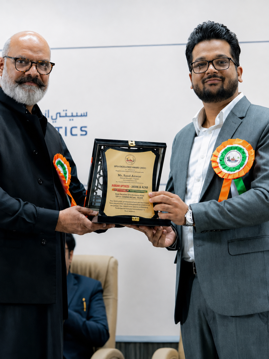 Saad Anwar receiving recognition at a public event